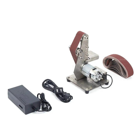 Hella Smooth Dual Bearing Mini Bench Belt Sander Including Ten Premium Sanding Belts for Polishing Grinding and Workshop Professional Tool Sharpening At Variable Speeds on a workspace with motor and belts.