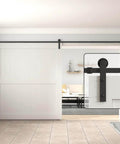 Black Straight Design Sliding Barn Door Hardware Kit for Single Wood Door, mounted with roller on white wooden door.