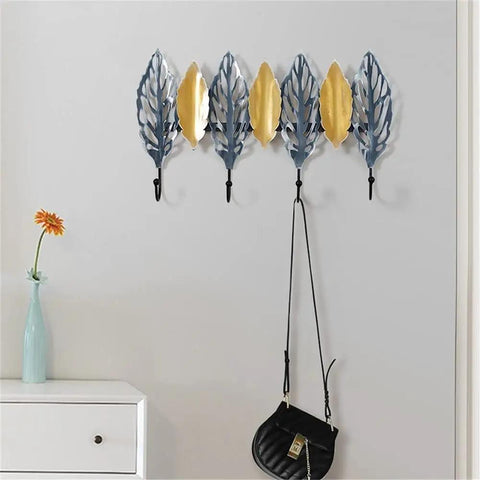 Big Letter Wall Mount Coat Hook Heavy Duty Entryway Key Organizer Sturdy Home Storage Rack With Durable Matte Finish hung with bags, featuring decorative leaf design.