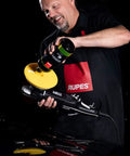 Person using dual action polisher with 100mm DA Fine Dual Action Foam Polishing Pad for paint correction and gloss enhancement