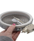 Hand holding a Radiant Surface Element Replacement For Electric Range Six And Three Eighths Inch 1200W DG47-00060A 4010987