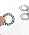 Close-up of Stainless Steel 304 External Toothed Lock Washers Star Gasket Serrated Assortment Kit 600 Pcs on white background