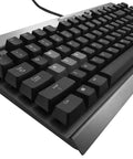 Goat Tier Compact Tenkeyless Mechanical Gaming Keyboard Featuring Cherry MX Red Switches angled view with black keys and metal frame.