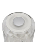 Top view of Your New Favorite Rechargeable Mini Washing Machine's control button with a silver finish.