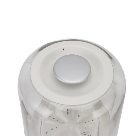 Top view of Your New Favorite Rechargeable Mini Washing Machine's control button with a silver finish.