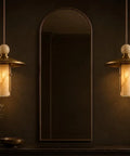 Modern Brass Pendant Chandelier Light Fixture with Alabaster Cylinder Shade Luxury Natural Stone Hanging Ceiling Light with Spherical Marble Accent for Kitchen Dining Room, Bar & Living Room Set of 3 in elegant interior.