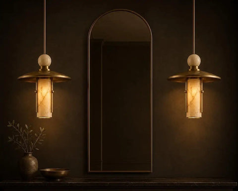 Modern Brass Pendant Chandelier Light Fixture with Alabaster Cylinder Shade Luxury Natural Stone Hanging Ceiling Light with Spherical Marble Accent for Kitchen Dining Room, Bar & Living Room Set of 3 in elegant interior.