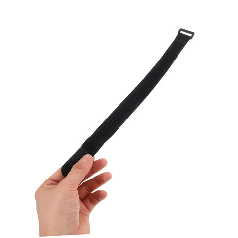 Hand holding a strap from 20 Pack Black Stretch Fabric Fire Extinguisher Mounting Straps For Hose And Vehicle Use Easy Install Durable Fixing Straps