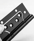 Heavy Duty Silent Flat Door Hinges With Screws Four Inch Thickened Anti Rust Stainless Steel Smooth Close Interior Door Hardware Zero Grind And No Squeak Nonsense, black hinge held in hand.