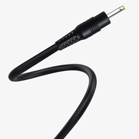 Close-up of a Slick One Meter Extension Cord With Bulletproof Housing For Home Office and Entertainment Setups smooth plug end.