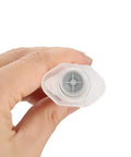 Hand holding nozzle of Green Light-Curing Solder Mask Ink For PCB Repairs With Light Exposure, showing applicator tip