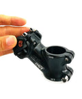 Close-up of black Thirty Five Degree 60mm Handlebar Stem Riser For One Inch Bars Fits Twenty Five Point Four Millimeter Bar Diameter.