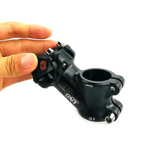 Close-up of black Thirty Five Degree 60mm Handlebar Stem Riser For One Inch Bars Fits Twenty Five Point Four Millimeter Bar Diameter.