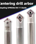 Three carbide-tipped 45-degree chamfering tool holders with white heads and metal shanks, front view