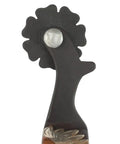 Close-up of Ladies Sunflower Spurs With Flower Overlay In Brown Iron, showing floral detail and craftsmanship.
