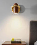 Fly Modern Metal Led Wall Sconce With Bulb Hardcore Adjustable Indoor Reading Lamp Featuring Slick Imitation Wood Grain Finish For Bedroom Kitchen Corridor mounted above nightstand with books.