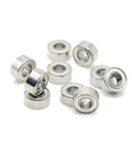 Super Cool Set Of 10 Tiny 2x6x3mm Mini Ball Bearings Made From Super Durable Chrome Steel arranged in a pile for nail drill use.