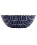 Close-up of navy ceramic scallop design base of Navy Ceramic Hand Painted Scallop Sphere Table Lamp With White Linen Drum Shade.