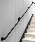Rock Solid Seven Feet Industrial Stair Handrail Featuring Non Slip Black Iron Pipe Construction For Wall Mounted Garage Steps Vintage Loft Porch And Real Deal Home Safety Upgrade mounted on white wall alongside marble staircase.