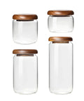 Four Piece Glass Storage Jars With Airtight Wooden Lids Wide Mouth Canister Set shown in various sizes for kitchen pantry use.