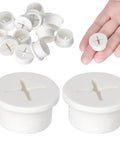 Twelve Pack One Inch White Silicone Cable Grommets For Home Office Desk Heavy Duty Wire Hole Covers stacked with hand holding one.