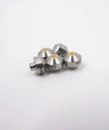 Front view of five silver ruby water-jet orifice nozzles for water jet cutting machines with gold centers.