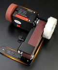 Badass Compact Desktop Electric Belt Sander Set For Sharpening Knives Metal Parts And Wood Projects With Adjustable Speed Settings on a black surface.