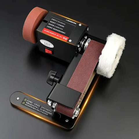 Badass Compact Desktop Electric Belt Sander Set For Sharpening Knives Metal Parts And Wood Projects With Adjustable Speed Settings on a black surface.