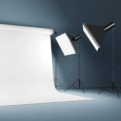 Studio setup with Heavy Duty Light Stand 9.5 Feet Adjustable Tripod for Photo Studio Gear and softbox lights on seamless backdrop