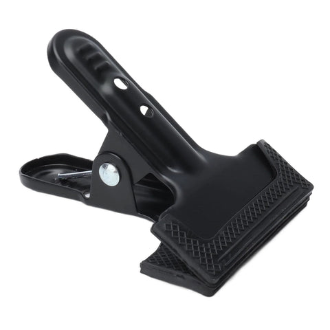 Close-up of a Set Of 4 Heavy Duty Wide Mouth Metal Spring Clamps For Woodworking And Diy Projects Great For Photography Backdrops Bonding Panels Hanging Fabric Papers And Small Fixtures Built From High Hardness Carbon Steel showing textured wide mouth and sturdy steel construction.
