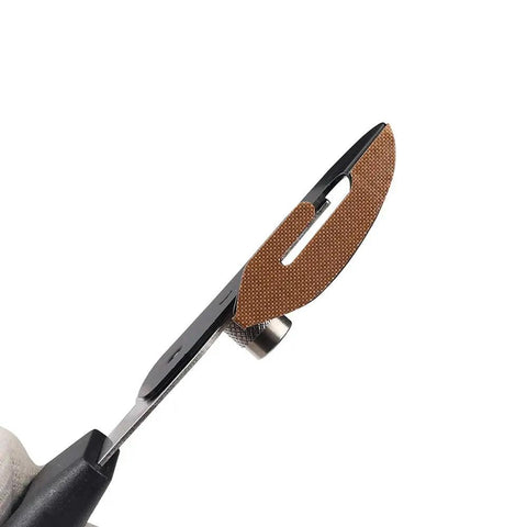 Slick Vinyl Wrap Cutting Knife With Hidden Stainless Blade And PTFE Coated Handle For Smooth Car Tinting and backing paper trimming close-up showing blade detail.