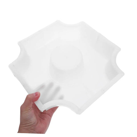 Hand holding Medium Hole Tiles Concrete Mold For Stepping Stones, Reusable DIY Garden Path And Patio Paver Maker, 10.62 X 10.62 X 2.36 In