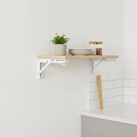 Sturdy Floating Shelf Brackets 7.7 X 5.1 X 2.9 Inches, Electroplated Stainless Steel With White Finish, installed in kitchen holding items