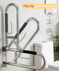 Real Deal 32 Inch Flip Up Toilet Safety Handle In Brushed Nickel Featuring Built In Paper Dispenser And Anti Slip Rubber Knobs Beefy 304 Stainless Steel Construction For Dependable Handicap Assistance And Wheelchair Accessible Restroom Design, angled view mounted on wall.