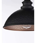 Close-up of Englewood Collection 1 Light Farmhouse Outdoor Post Lantern in textured black with hammered steel shade and copper interior.