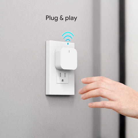 ZigBee 3.0 Bluetooth Smart Home Gateway Hub For A Multi-Protocol Setup, plug into wall outlet, hand reaching, shows WiFi signal
