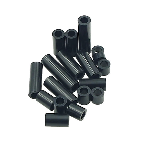 Black ABS Round Spacers Kit For M4 Screws, Unthreaded Standoffs, Metric 7Mm OD By 4.2Mm ID in various sizes laying on surface