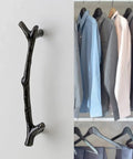 Large Vintage Tree Twig Branch Cabinet Knob shown in close-up with wardrobe in background; Black zinc alloy handle for farmhouse decor.