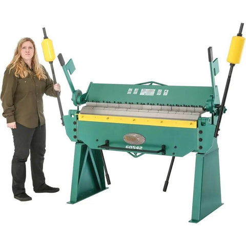 Person standing beside the G0542 Beefy 48 Inch 12 Gauge Pan And Box Brake Heavy Duty Metal Fabrication Tool with handles raised.