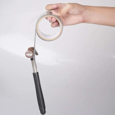 2 Inch By 140 Inch Screen Repair Kit With Fiberglass Tape held in hand, showing adhesive side for door and window screen repair.