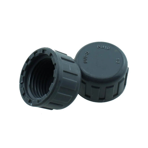 Two SQXBK 12-Piece 1/2 Inch PVC Inner Teeth Pipe Plugs showing threaded design for irrigation systems and water supply lines.