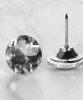 A Total Knockout Thirty Piece Set Of Twenty Five Millimeter Diamond Crystal Upholstery Tacks With Silver Plated Nails for furniture.