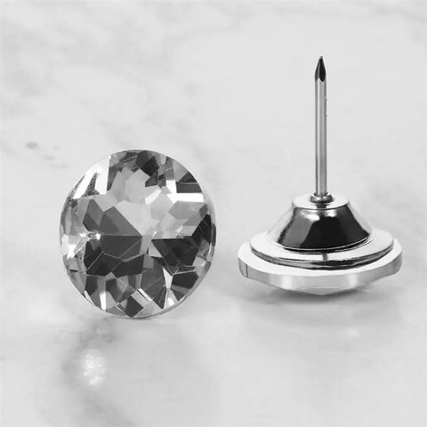 A Total Knockout Thirty Piece Set Of Twenty Five Millimeter Diamond Crystal Upholstery Tacks With Silver Plated Nails for furniture.