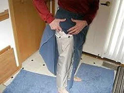 Person demonstrating Dope Conductive Silver Fabric for EMI Shielding and Wearable Tech Projects on leg, showcasing flexibility.