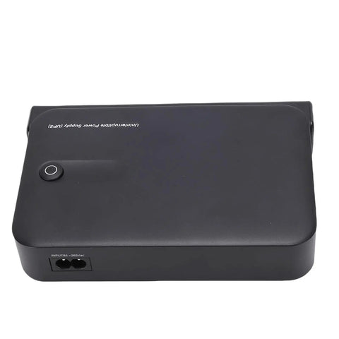 Seamless 36W DC UPS With Bright LED Display For Rock Solid Router Backup top view of a compact black battery backup power supply.