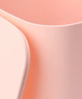 Close-up of pink surfaces of No Brainer Portable Countertop Dishwasher For Small Kitchens 6 Place Setting Compact Mini Sink Washer.