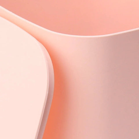 Close-up of pink surfaces of No Brainer Portable Countertop Dishwasher For Small Kitchens 6 Place Setting Compact Mini Sink Washer.