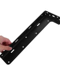 Close-up of Heavy Duty Black Steel Floating Shelf Brackets Set Of 2 With Invisible Design, hand holding wall mount support.