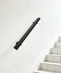 Tough As Nails Flush Wall Mount Handrail Made From Premium Stainless Steel For Secure Indoor Steps mounted on white wall beside stairs.