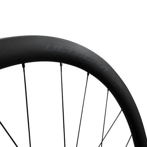 Close-up of Ultegra WH-R8170 C36 Carbon Road Wheelset Tubeless Ready For Disc Brakes 700c with 36mm deep rim and spokes.